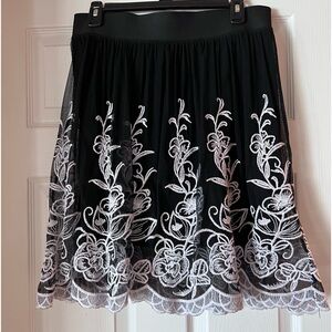 Black tulle skirt with white embroidery